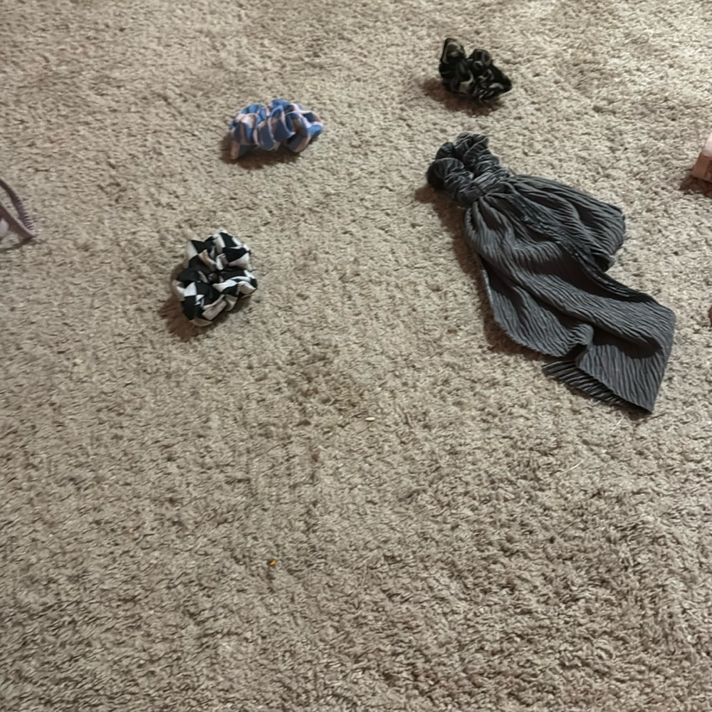 I am selling four hair ties, gray cheetah print, blue and pink, white and black